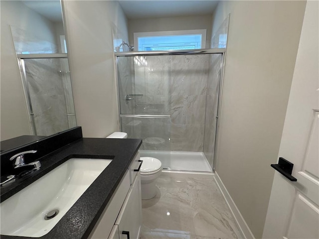 bathroom with walk in shower, vanity, and toilet