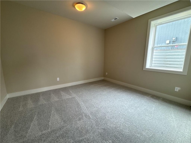 spare room featuring carpet flooring