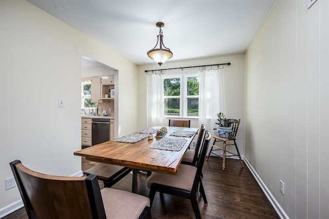 dining room with dark wood-type flooring