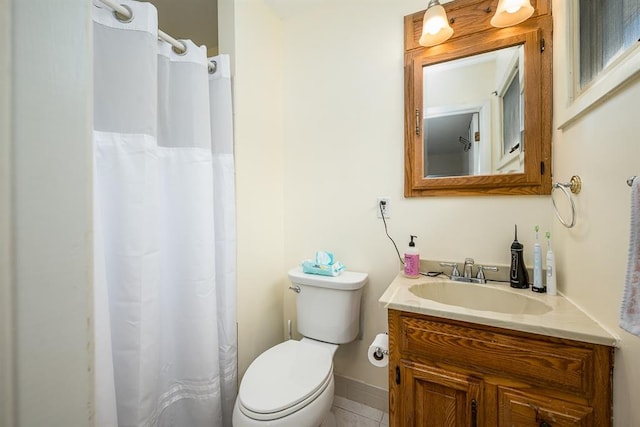 bathroom with tile patterned flooring, vanity, toilet, and a shower with shower curtain