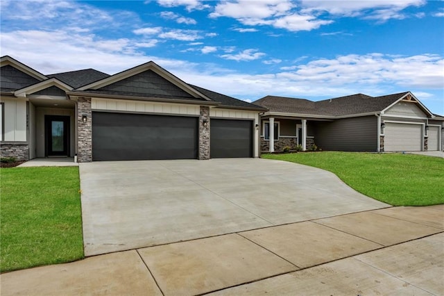 view of front of house featuring a garage and a front lawn