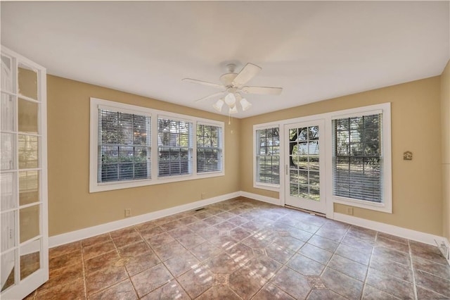 unfurnished room with ceiling fan