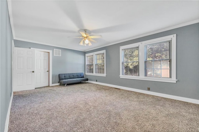 unfurnished room featuring crown molding, ceiling fan, and carpet floors