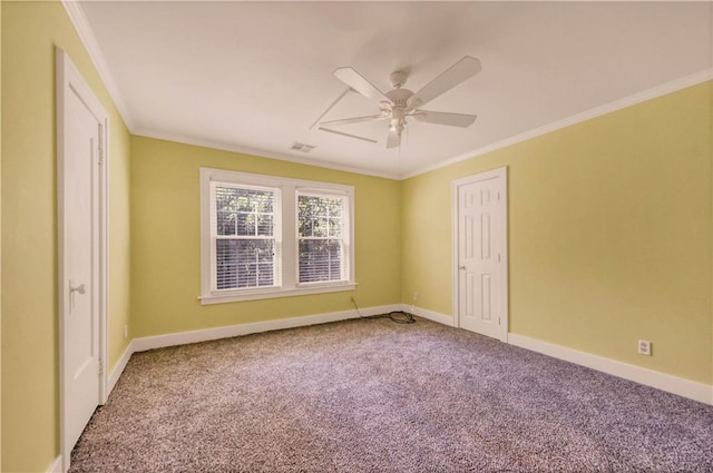 carpeted empty room featuring crown molding and ceiling fan