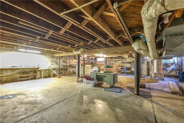 basement featuring washer and clothes dryer