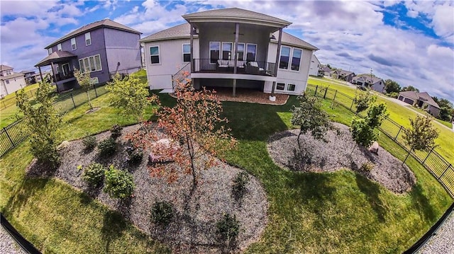 rear view of house with a yard