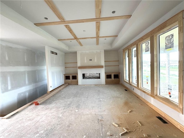 unfurnished living room featuring visible vents and a fireplace