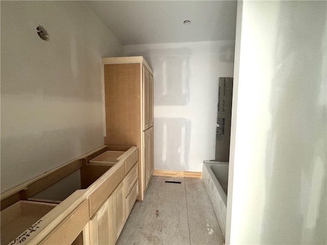 full bath featuring a shower and a tub to relax in