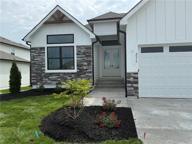 3215 SW Enoch St, Lees Summit, MO 64082 - view of front of property featuring stone siding, a garage, and board and batten siding
