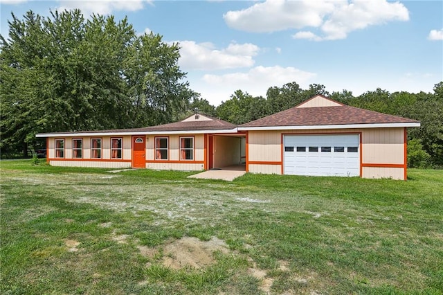 ranch-style home with a front yard and a garage