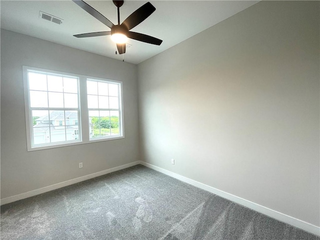 carpeted empty room featuring ceiling fan