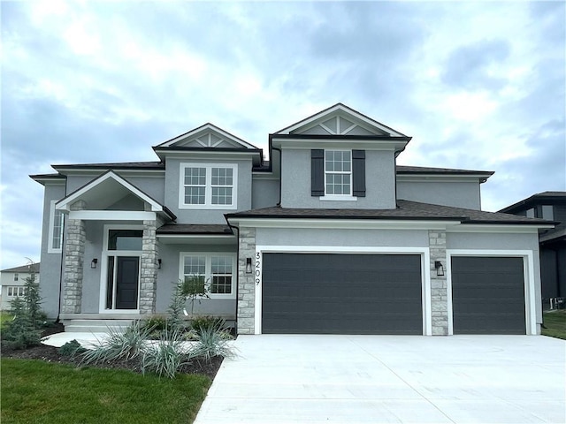 view of front of property with stucco siding, stone siding, and concrete driveway