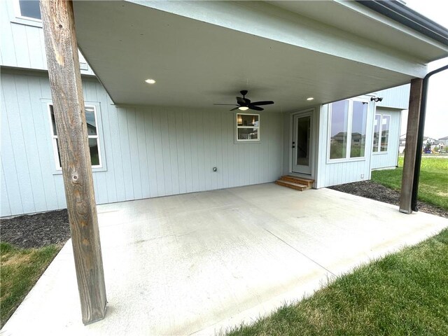 view of patio with a carport and ceiling fan