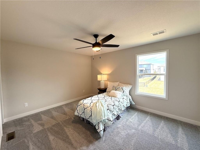 bedroom with baseboards, visible vents, and carpet floors