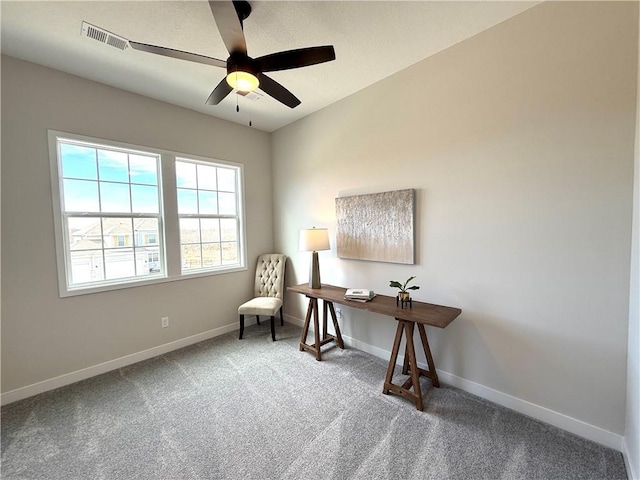 carpeted office with a ceiling fan, baseboards, and visible vents