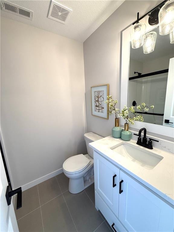 full bath featuring tile patterned floors, visible vents, toilet, and vanity