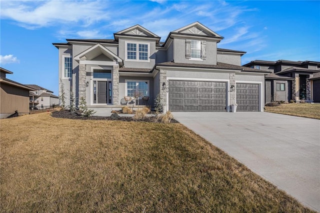 view of front of house with a front yard, an attached garage, concrete driveway, and stucco siding