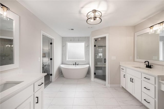 full bathroom featuring a shower stall, a sink, visible vents, two vanities, and marble finish floor