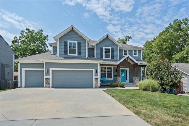 craftsman inspired home featuring a porch, driveway, stone siding, and a front lawn