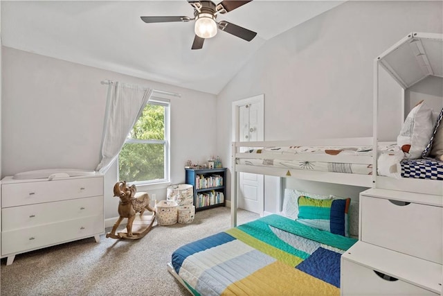 bedroom featuring a ceiling fan, carpet, and lofted ceiling