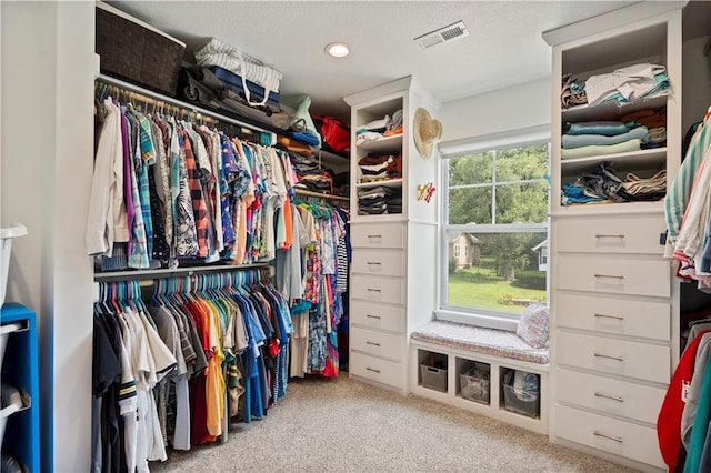 walk in closet with carpet flooring and visible vents