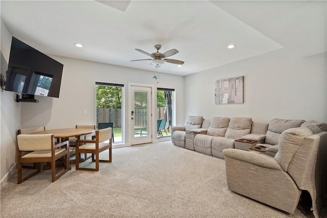 living room featuring carpet flooring, ceiling fan, baseboards, and recessed lighting