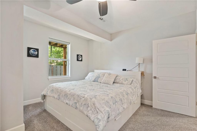 bedroom with visible vents, baseboards, ceiling fan, and light colored carpet