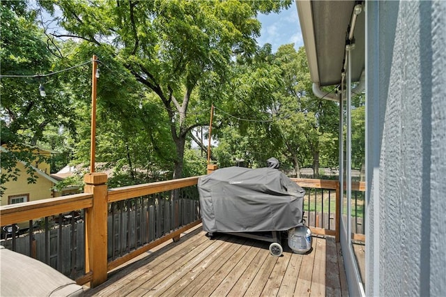wooden terrace featuring grilling area