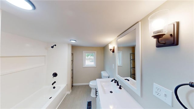 full bathroom featuring vanity, toilet, tile patterned floors, and tub / shower combination