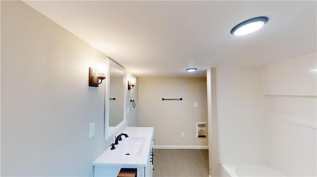 bathroom with walk in shower and vanity