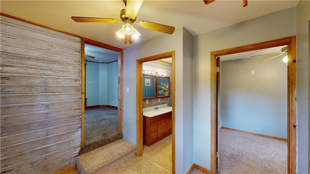 bathroom featuring ceiling fan and vanity