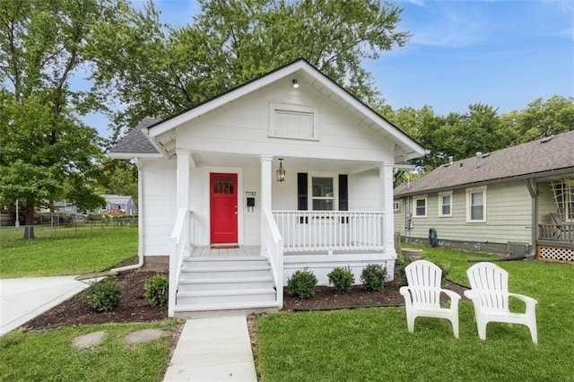 bungalow-style home featuring a front lawn