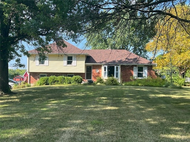 split level home with a front yard