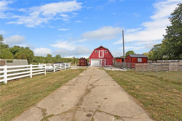 exterior space with an outdoor structure and a yard