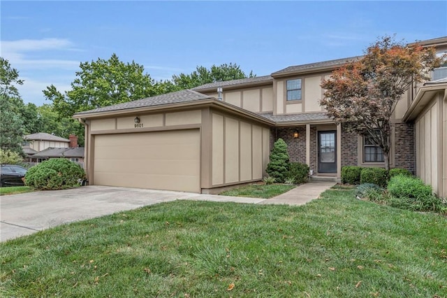 view of front of house featuring a garage and a front lawn