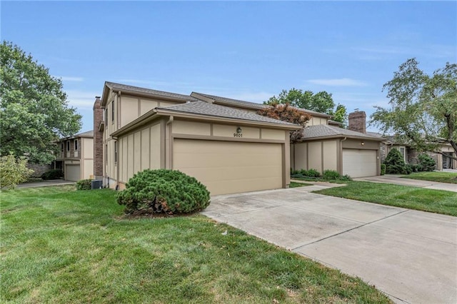 view of front of house featuring a garage and a front lawn