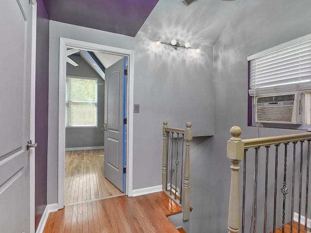 interior space with cooling unit and light wood-type flooring