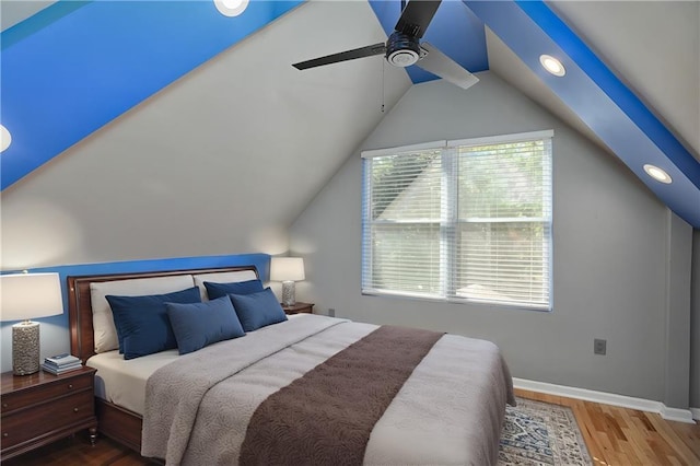 bedroom featuring wood-type flooring, ceiling fan, and vaulted ceiling