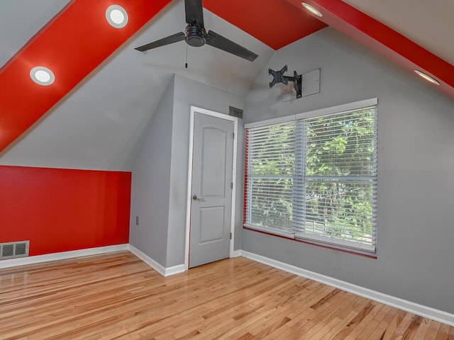 additional living space with ceiling fan, lofted ceiling, and light hardwood / wood-style floors