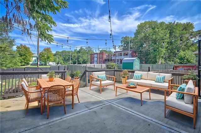 view of patio / terrace featuring a storage unit and an outdoor hangout area