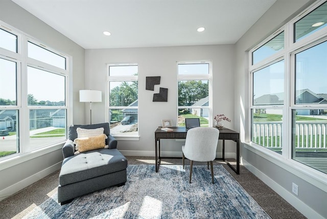 interior space with baseboards and recessed lighting