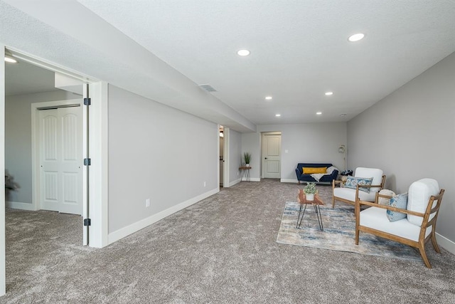 sitting room with carpet floors, recessed lighting, and baseboards