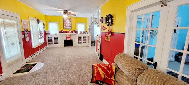 playroom featuring a baseboard heating unit, ceiling fan, and carpet