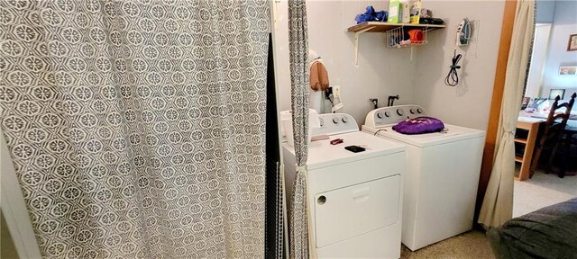 washroom with washer and dryer