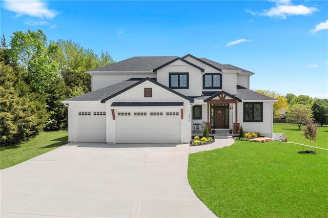 view of front facade with a garage and a front yard