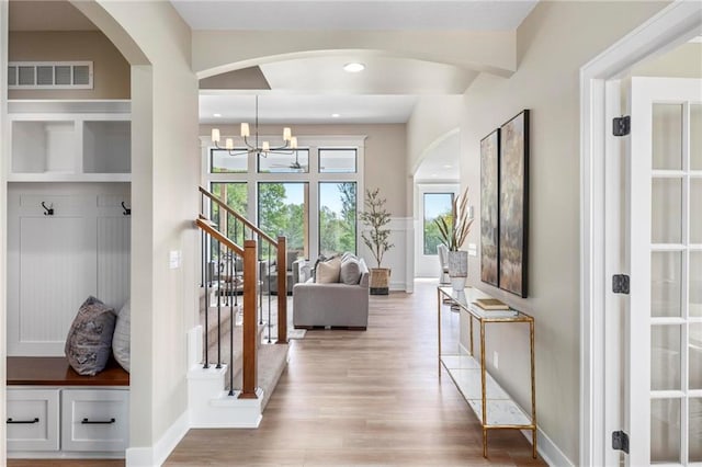 interior space featuring hardwood / wood-style floors and a notable chandelier