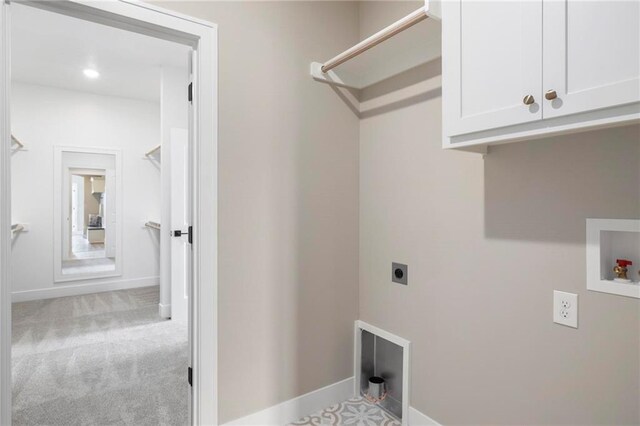 laundry room with washer hookup, cabinets, light carpet, and hookup for an electric dryer