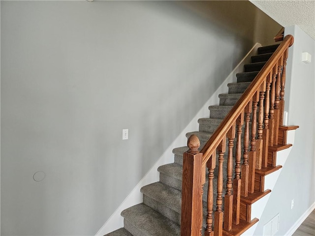 staircase with baseboards