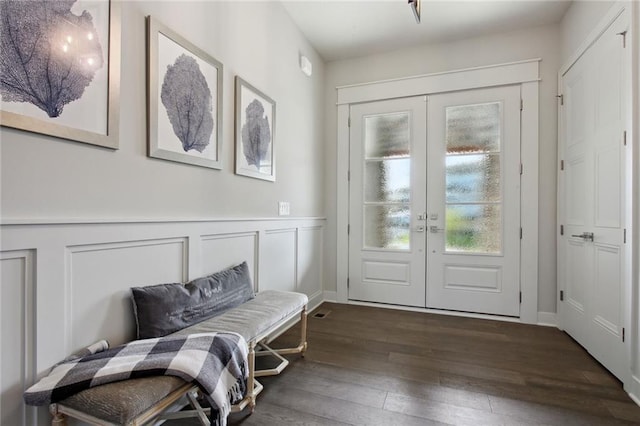 doorway with dark hardwood / wood-style flooring and french doors