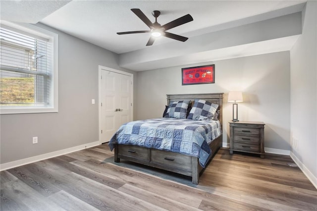 bedroom featuring wood-type flooring and ceiling fan